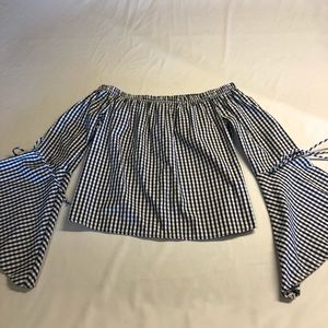 off the shoulder. flared, long sleeved top